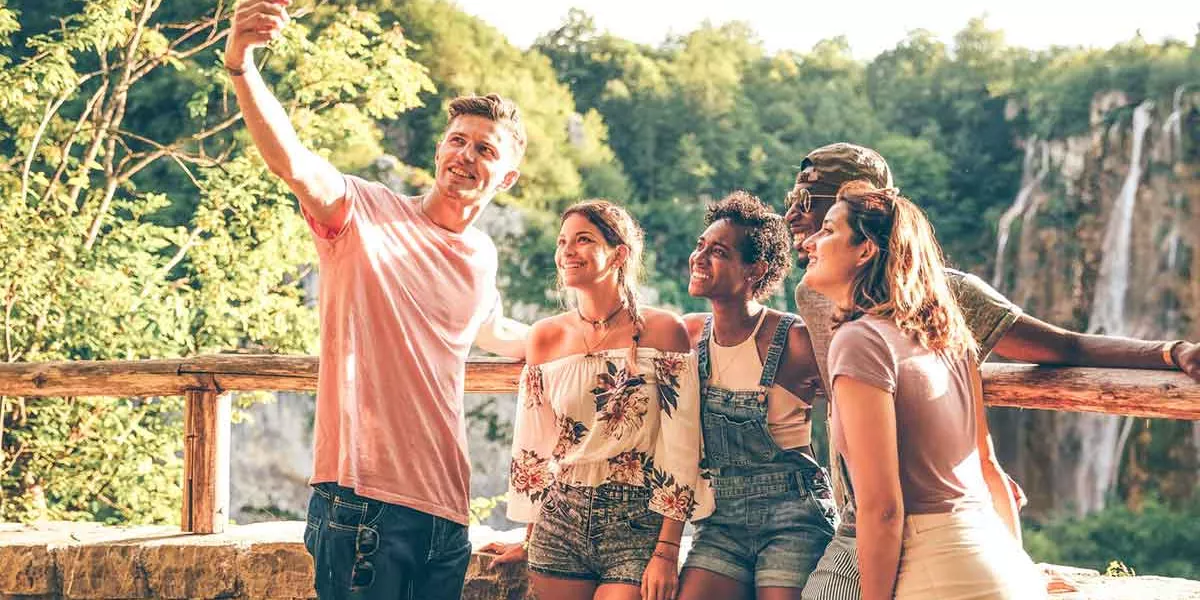 Group Young People Taking Selfie With A Nature Landscape At The Background (1)
