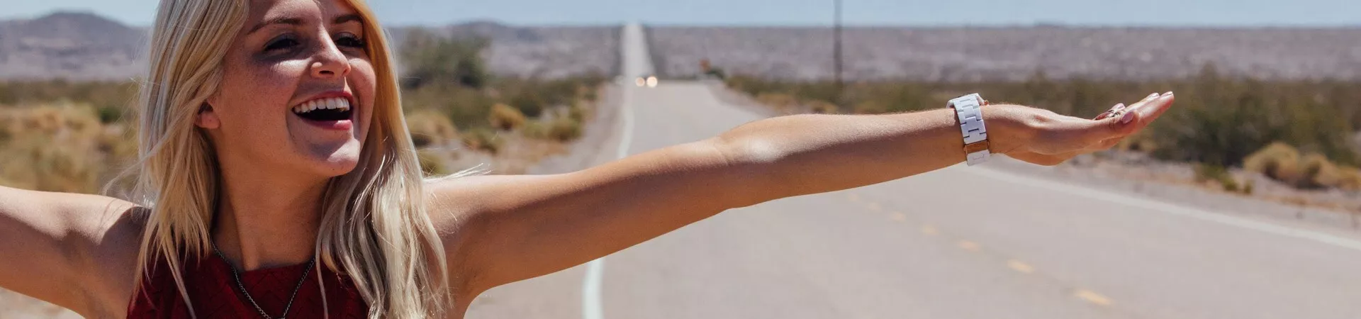 Girl laughing walking down the road