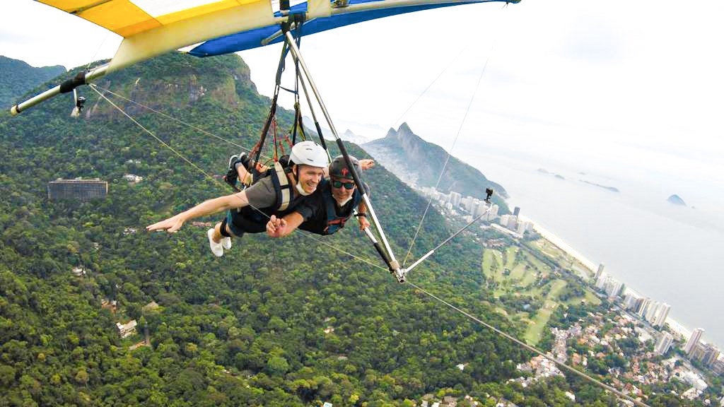 Traveler Hang Gliding over Rio De Janeiro in Brazil
