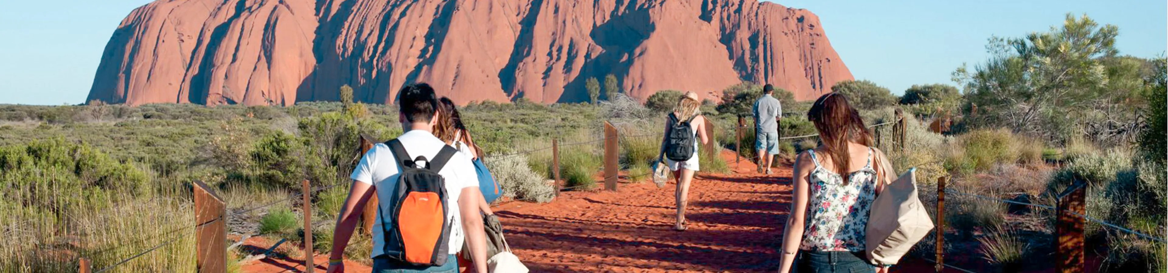 Travellers going to Uluru in The Outback