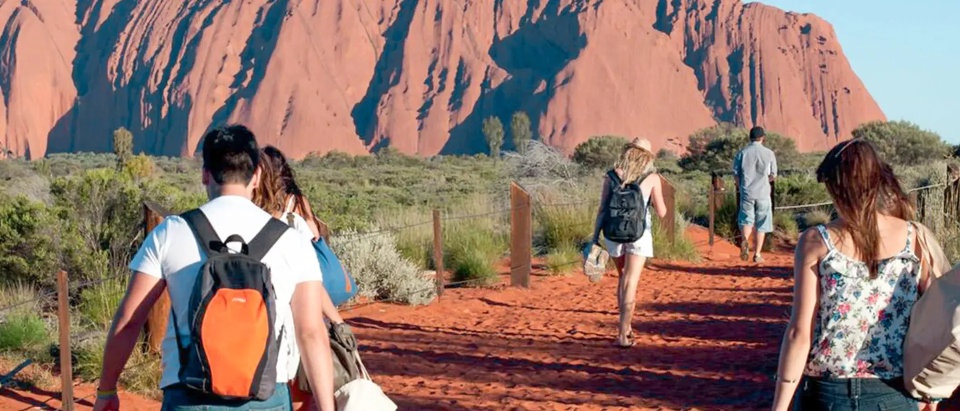 Travellers going to Uluru in The Outback