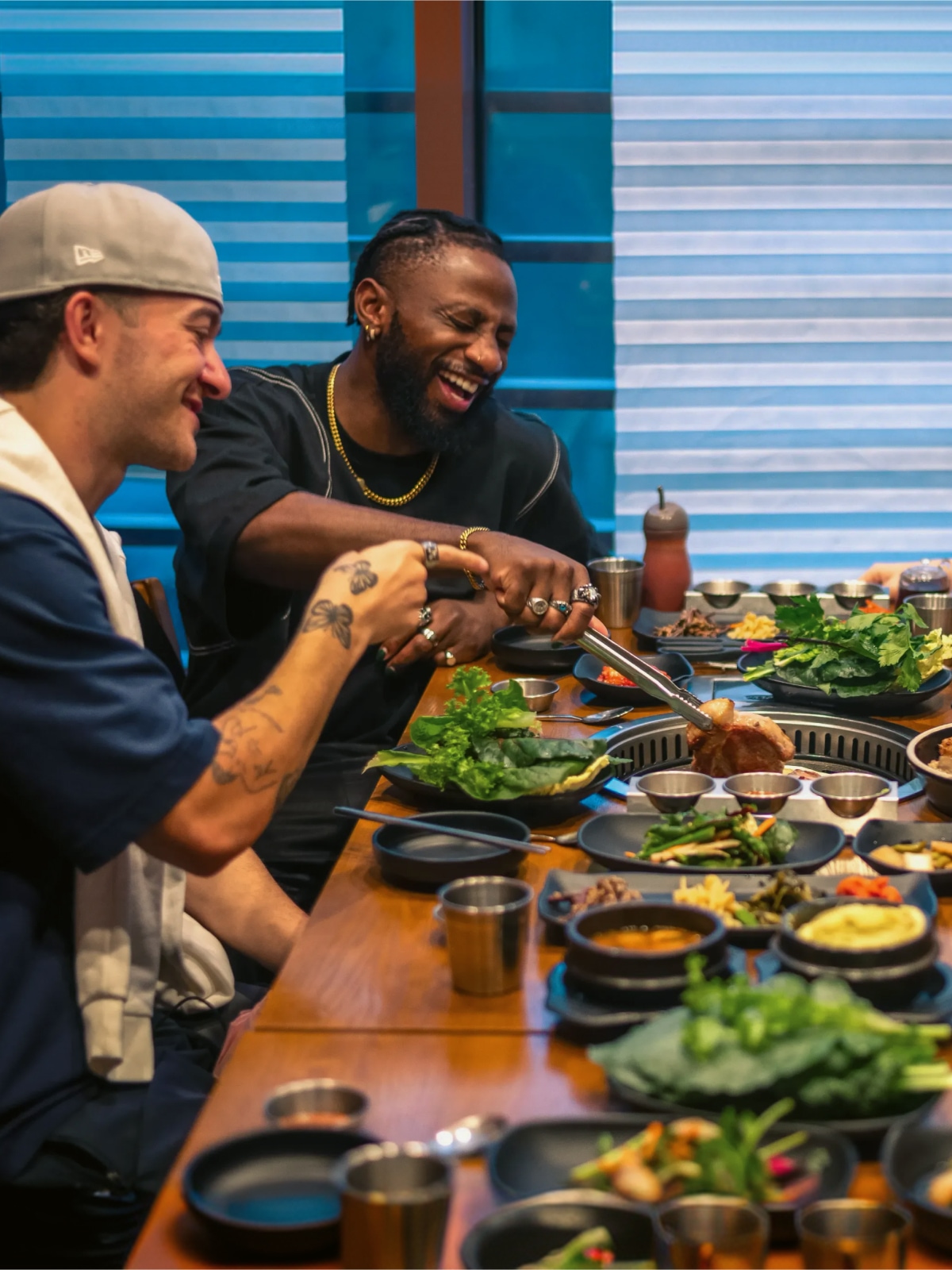 Travellers enjoying a Korean barbecue meal at a restaurant in South Korea.