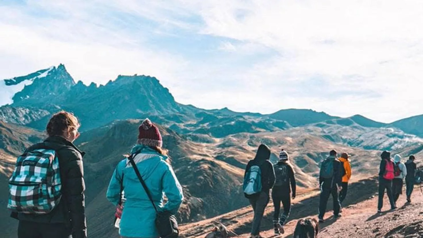 Group Of Travellers In Mountains