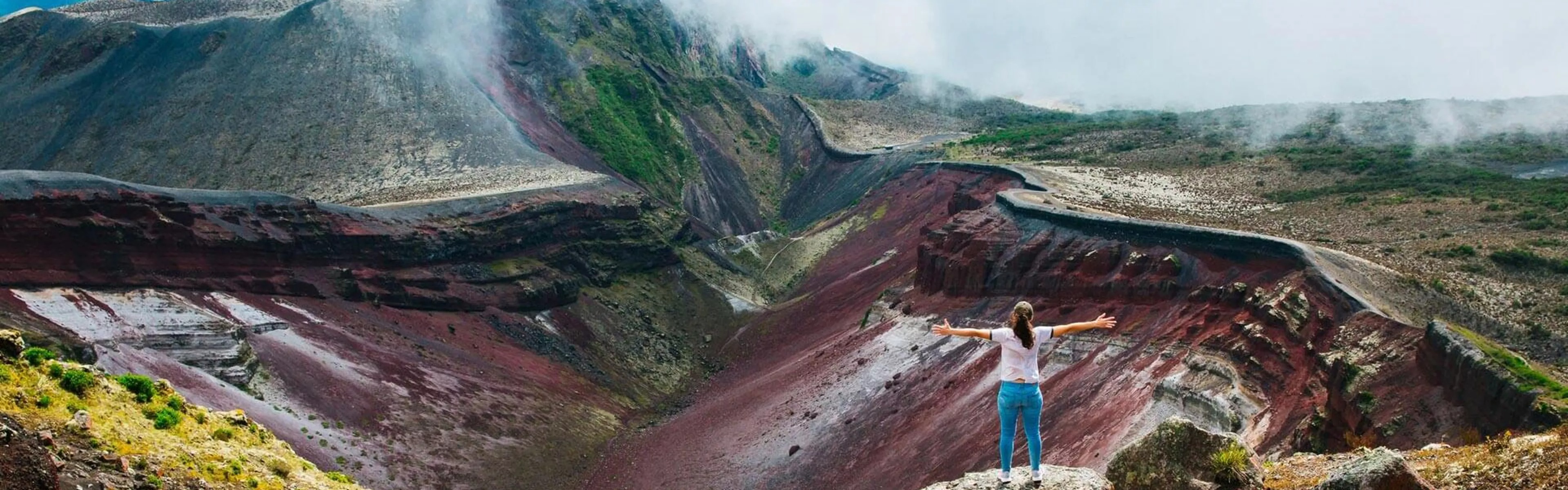 Solo female traveller standing on rock mountains