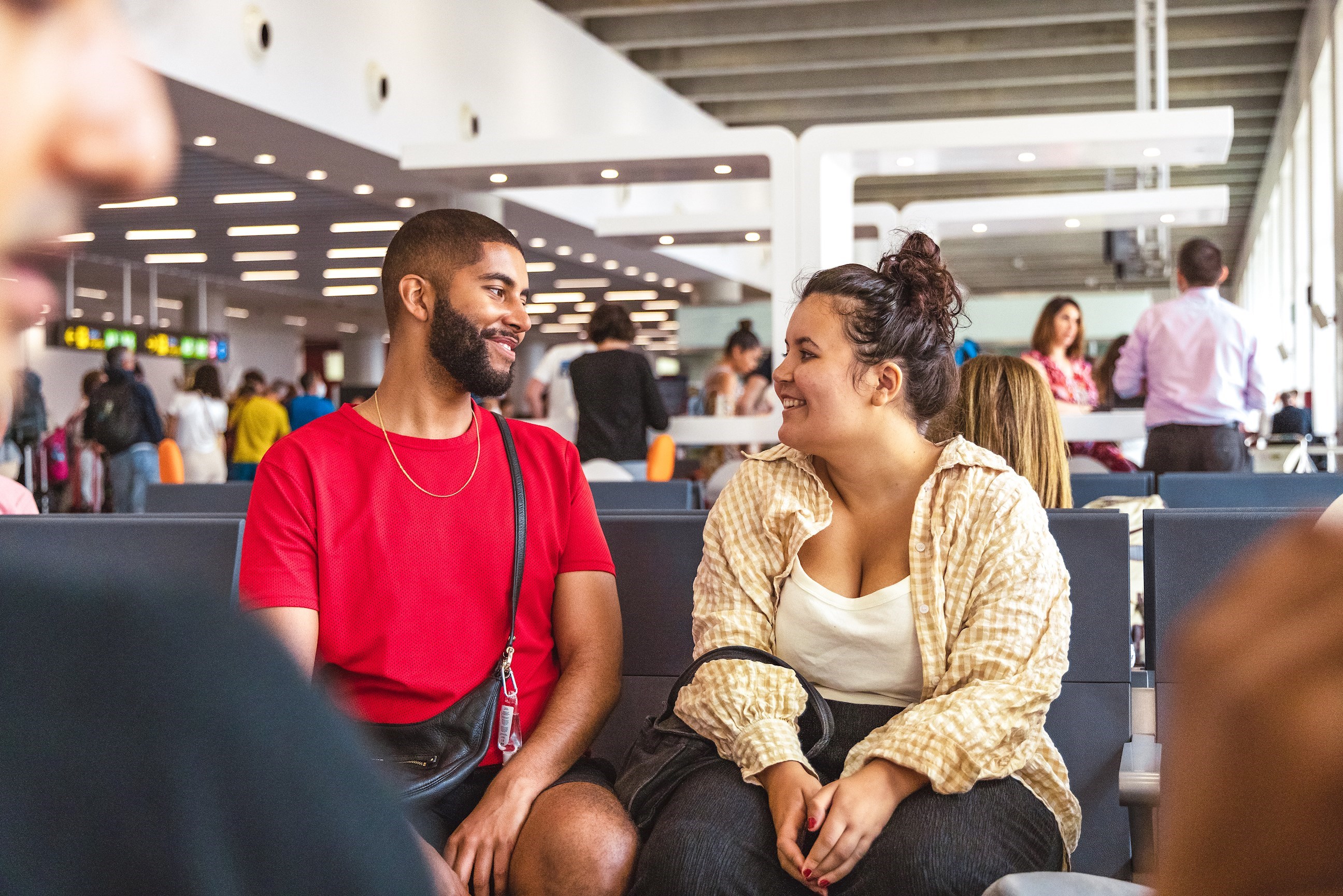 Travellers waiting for flight in airport