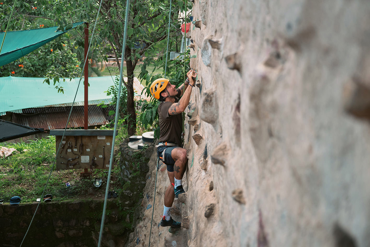 Traveller descending a rock climbing wall in Sagana, Kenya