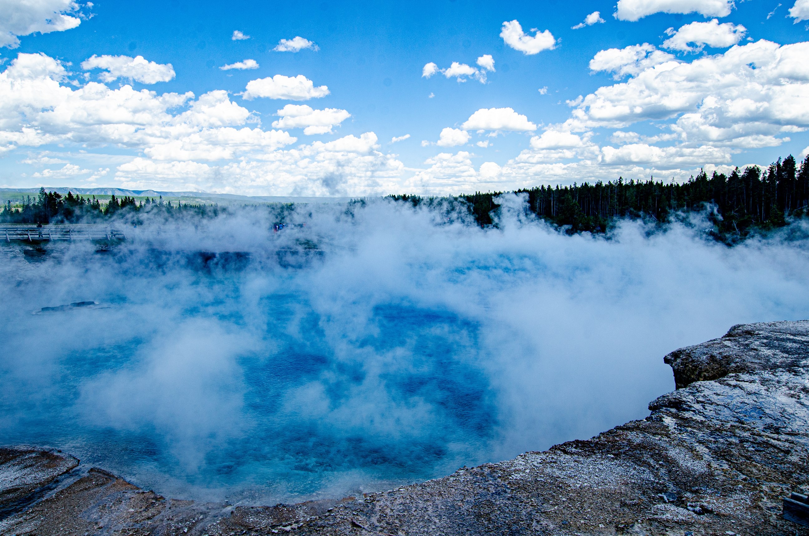 See the Mud Volcano and Dragon's Mouth Spring