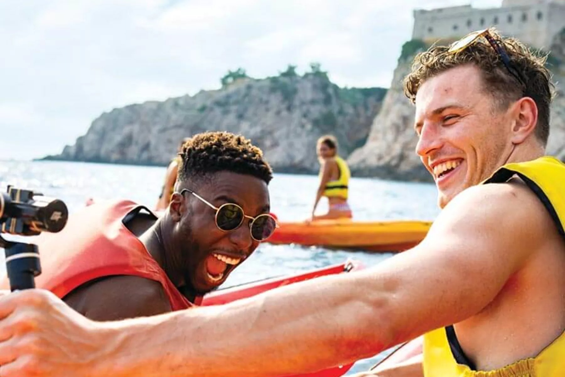 Young travellers take selfie on kayak