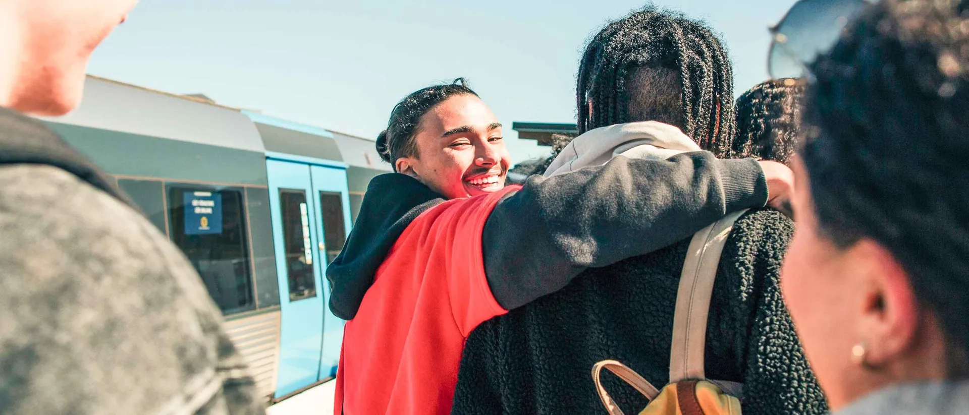 Group Of Young Travelers On Train Platform