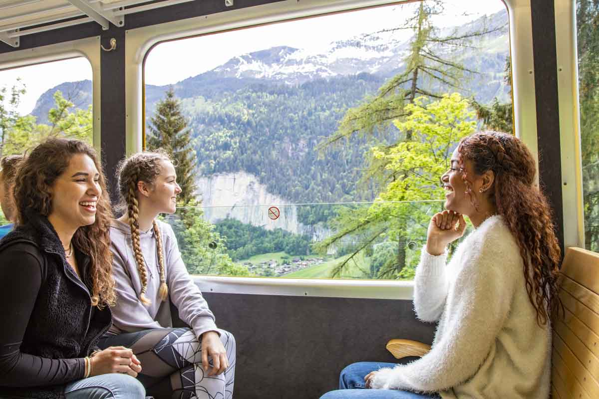 Travelers On Train Chatting In Switzerland
