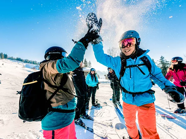 Hi Fiving Skiers Austria