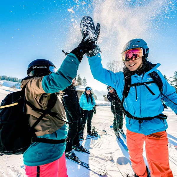 Hi Fiving Skiers Austria