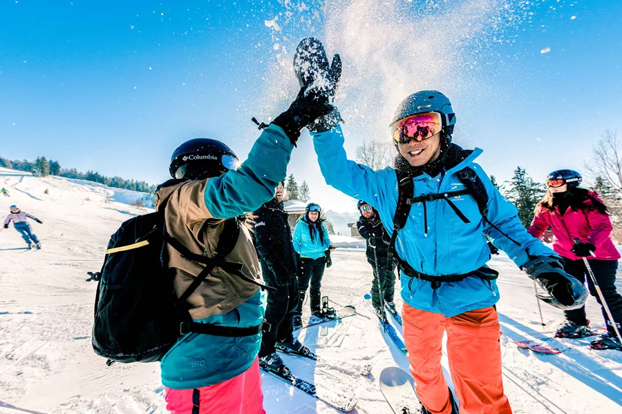 Hi Fiving Skiers Austria