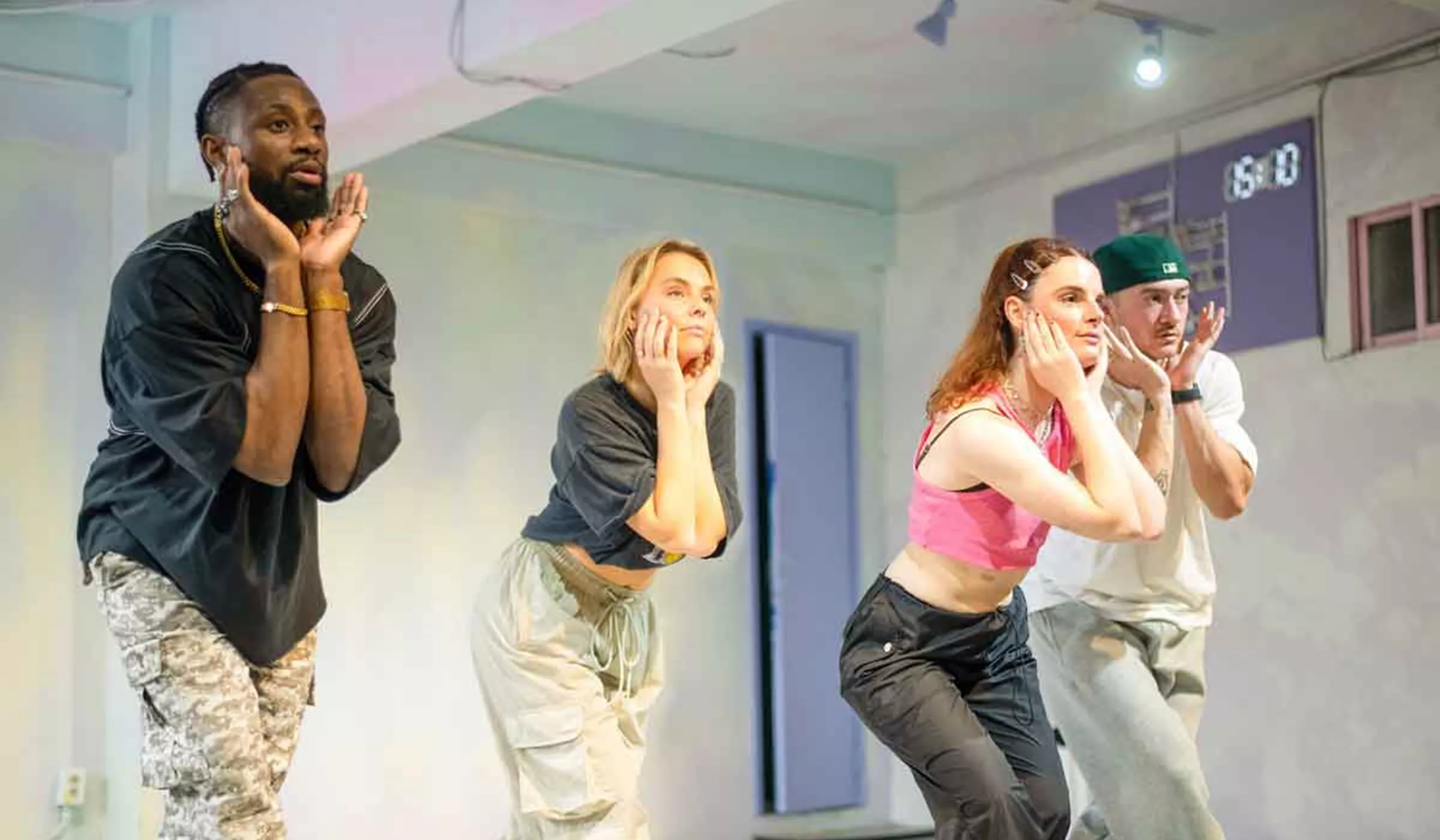 Young people dancing K-pop in a studio