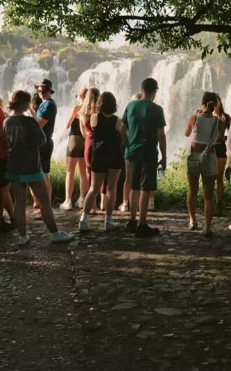 Contiki travellers viewing Victoria Falls from a rainforest lookout on the Victoria Falls Mini Break Tour