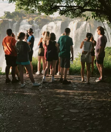 Contiki travellers viewing Victoria Falls from a rainforest lookout on the Victoria Falls Mini Break Tour