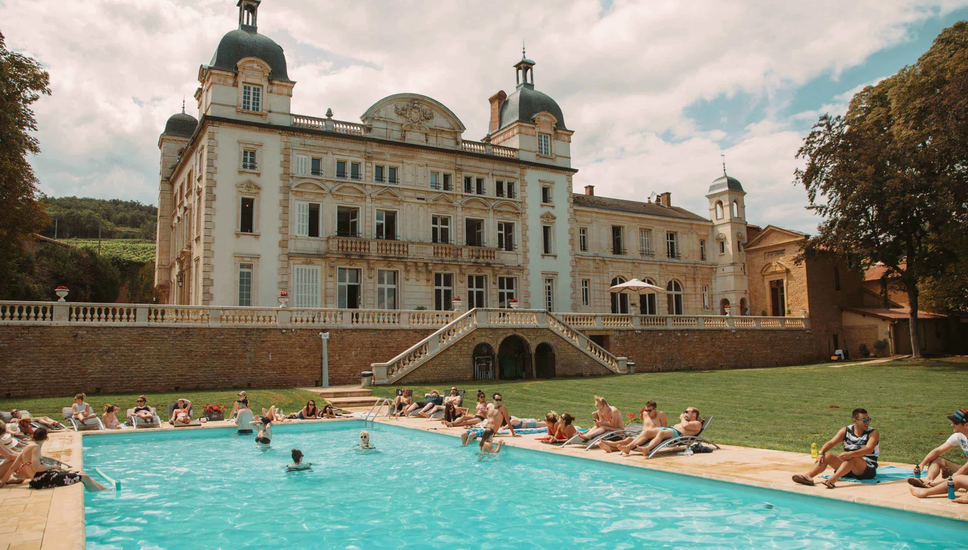 Travellers Enjoying Chateau Pool France
