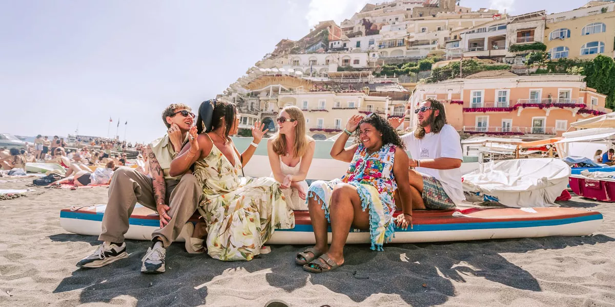 Friends Enjoying A Sunny Day At The Beach