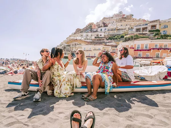 Friends Enjoying A Sunny Day At The Beach