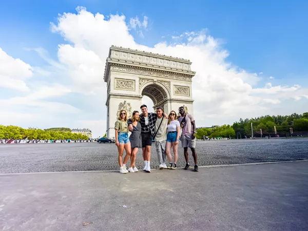 Friends Taking A Photo Close To A Landmark Paris