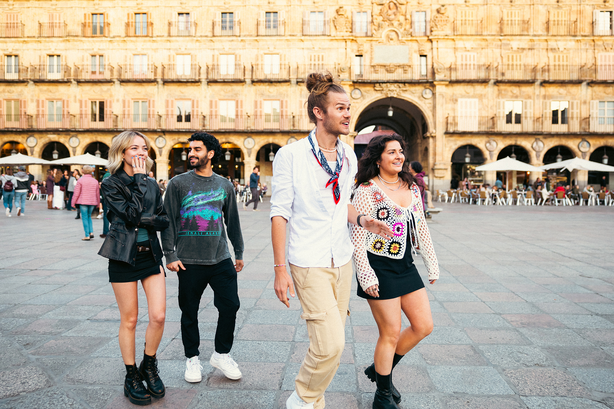 Travellers walking through Plaza Mayor, Salamanca, Spain