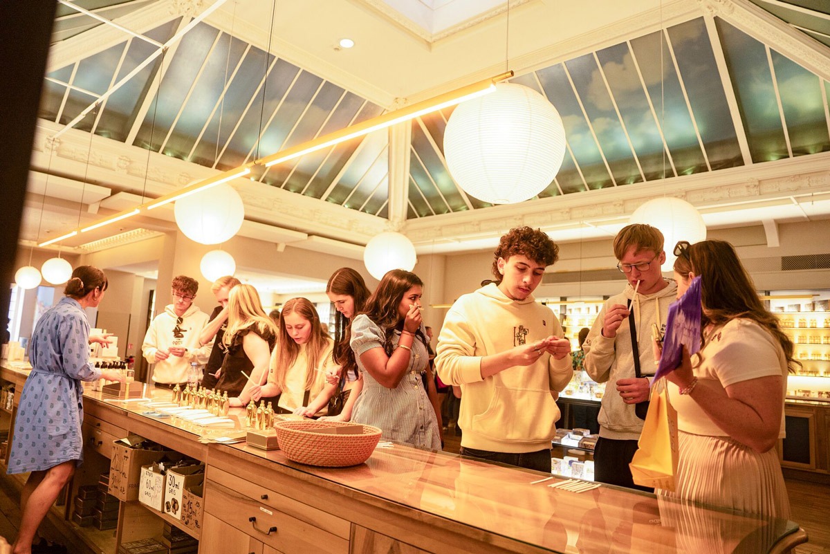 People visiting a perfumery in France.