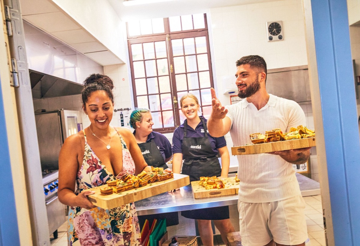 Travellers and Staff preparing a sustainable meal at the Contiki Château in Beaujolais wine region in France