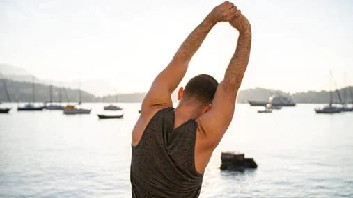 A man stretching in seaport