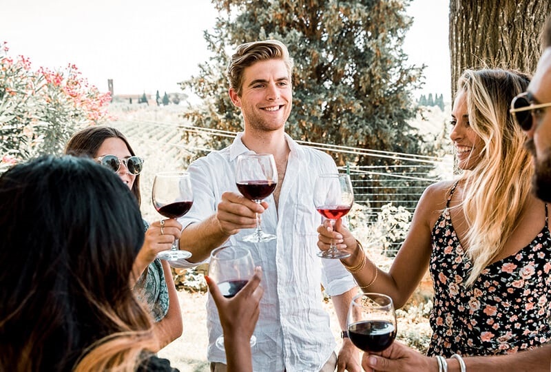 People making toast in the vineyard