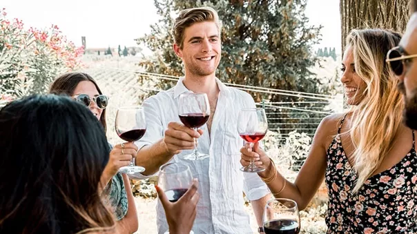 People making toast in the vineyard