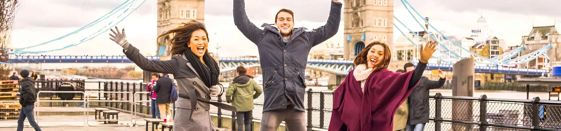 Happy Young Friends Jumping Tower Bridge Background