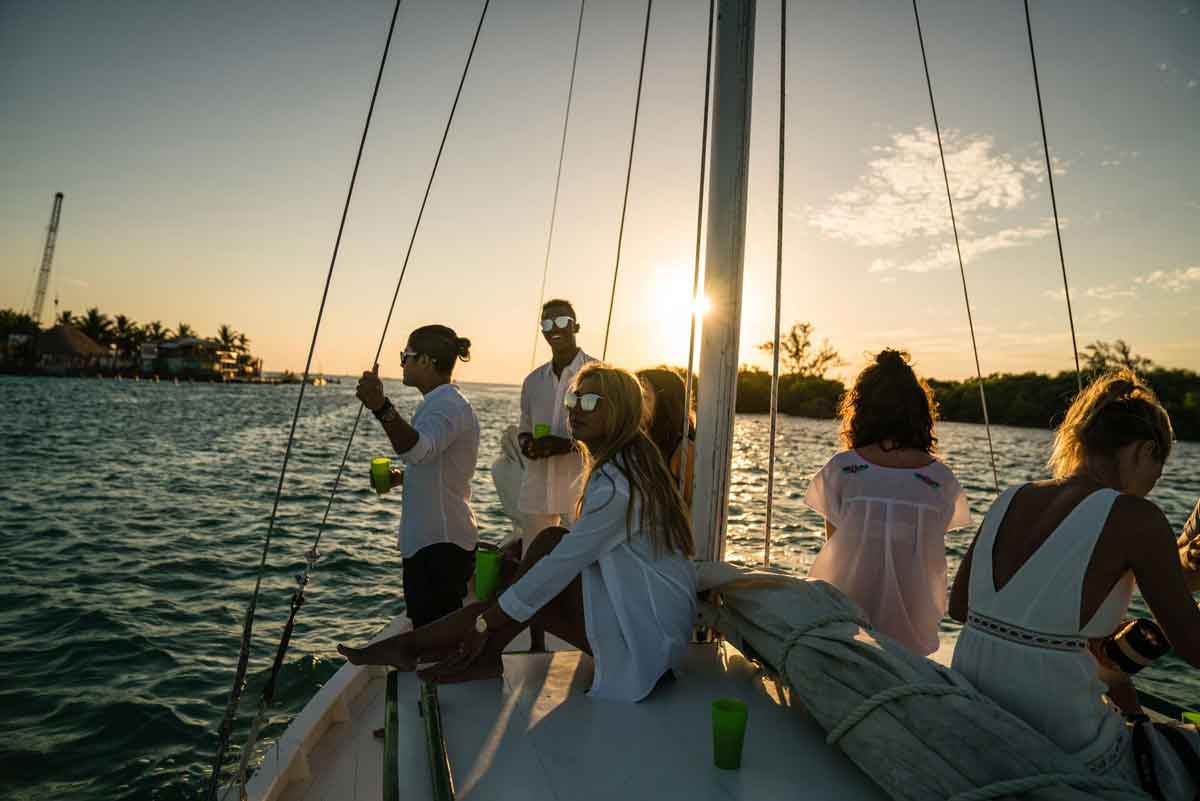 Group Of People Enjoying Sunset In A Boat