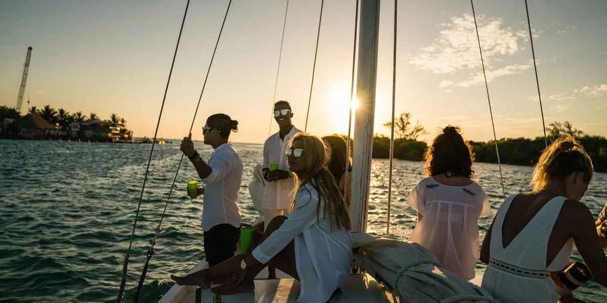 Group Of People Enjoying Sunset In A Boat