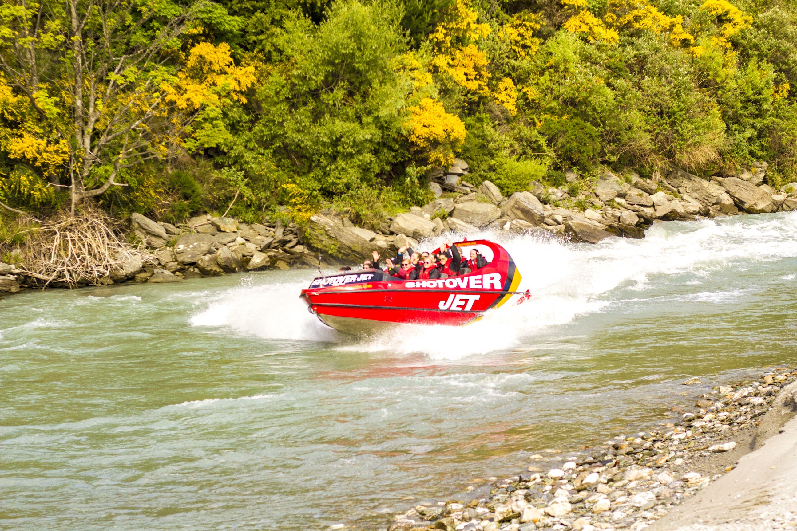 Travellers enjoying the Shotover Jet experience