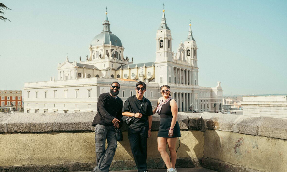 Friends Stood In Front Of Almudena Cathedral In Madrid Spain