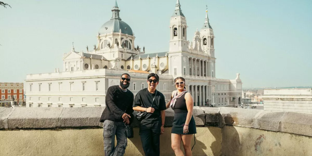 Friends Stood In Front Of Almudena Cathedral In Madrid Spain