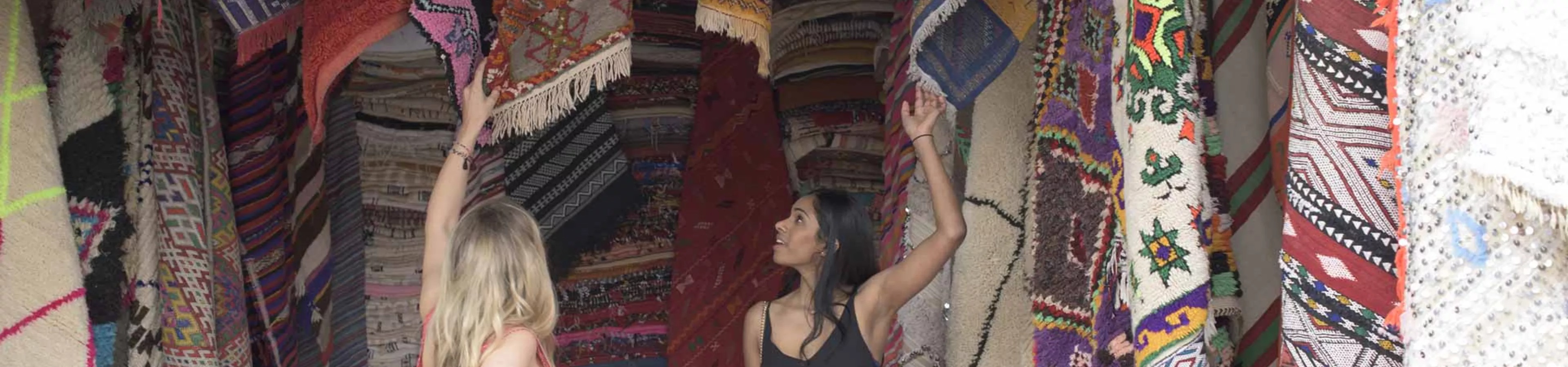 Travellers watching carpets in Jordan