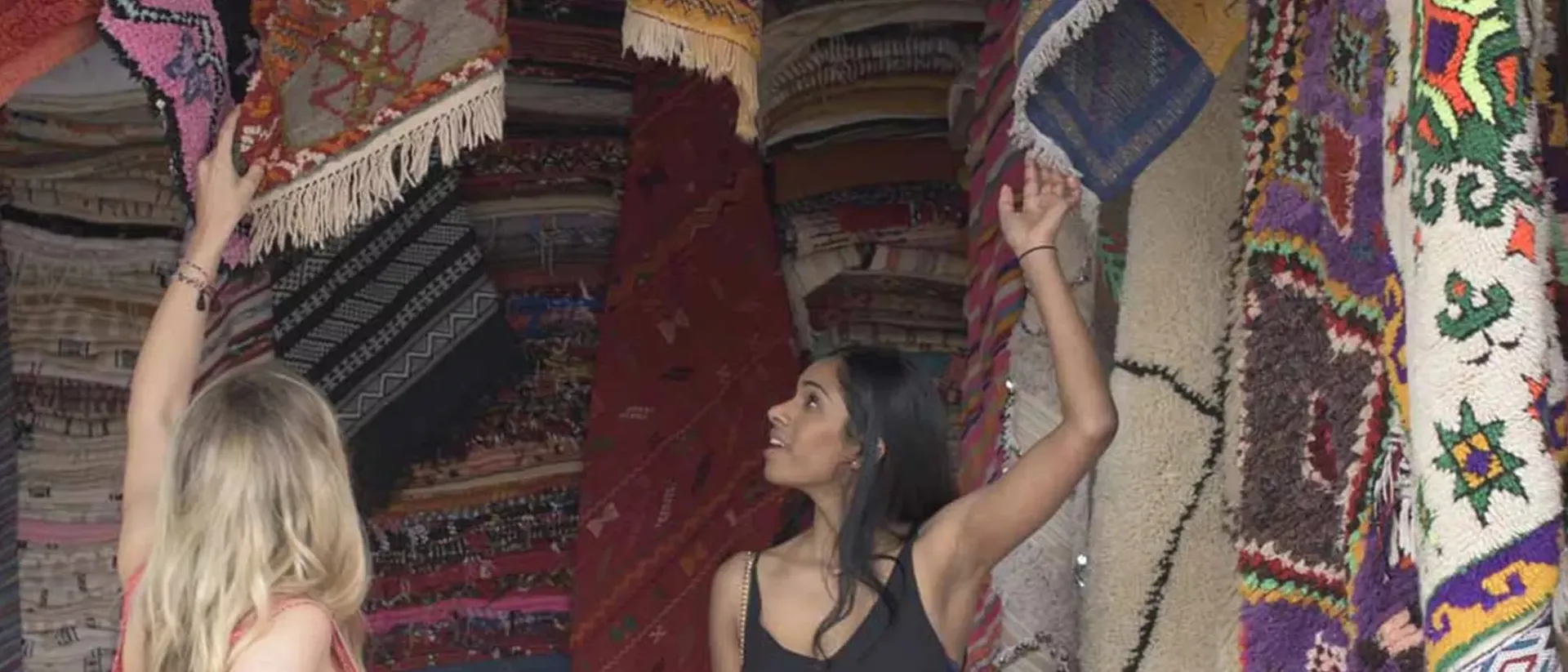 Travellers watching carpets in Jordan