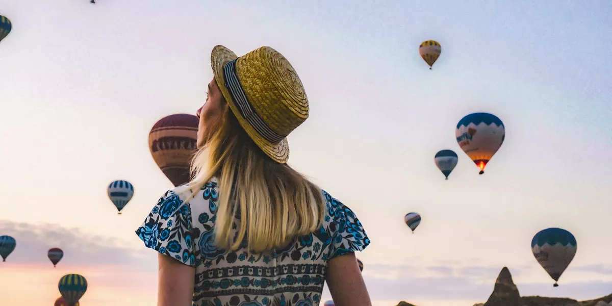 Traveller observing hot air balloons in Turkey