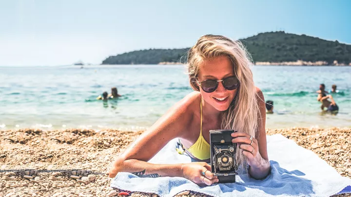 Traveller taking a picture on the beach in Croatia