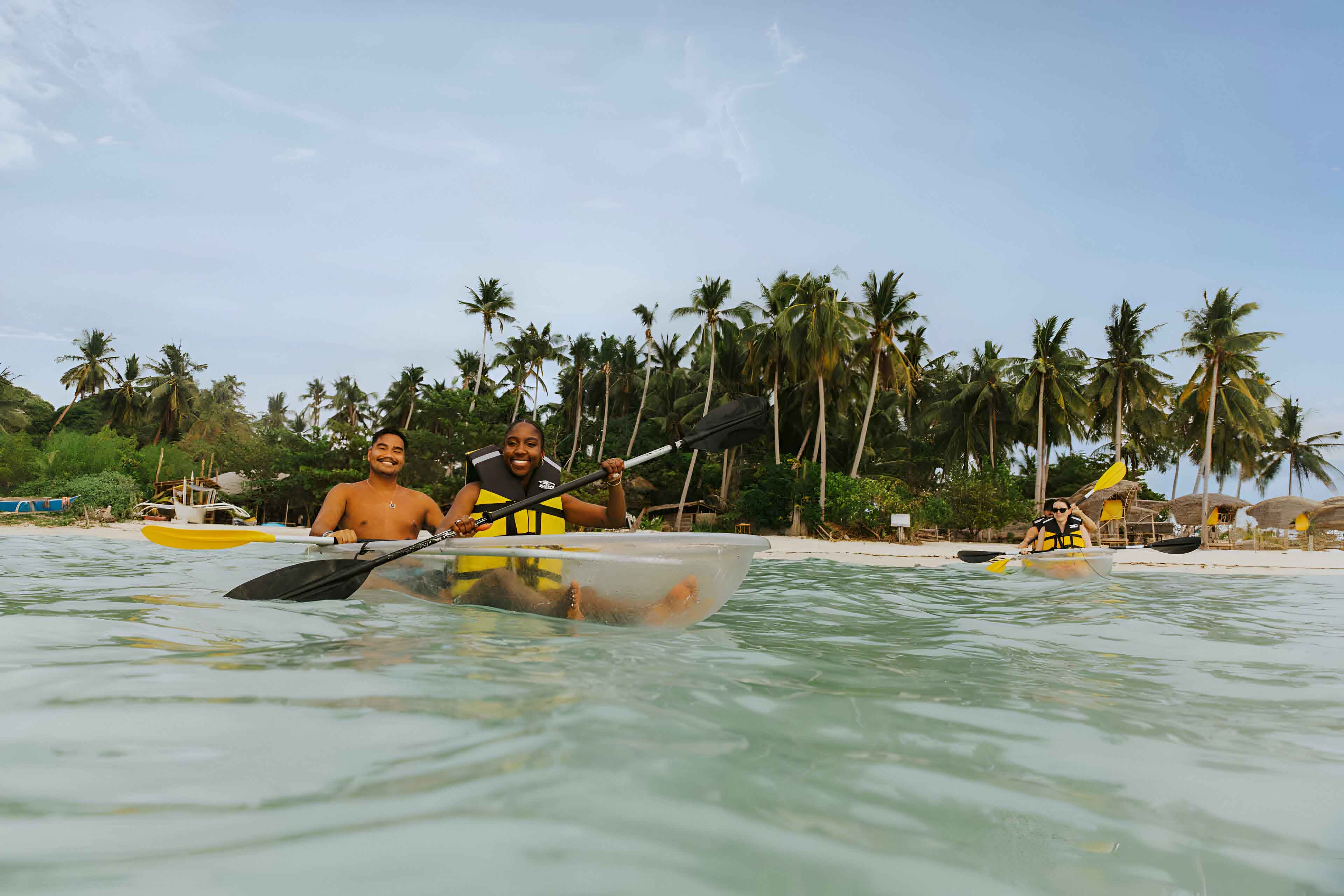 travellers kayaking in the sea