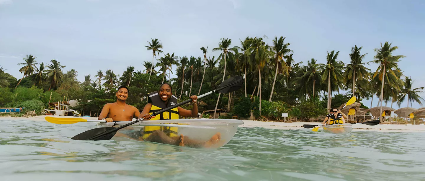travellers kayaking in the sea