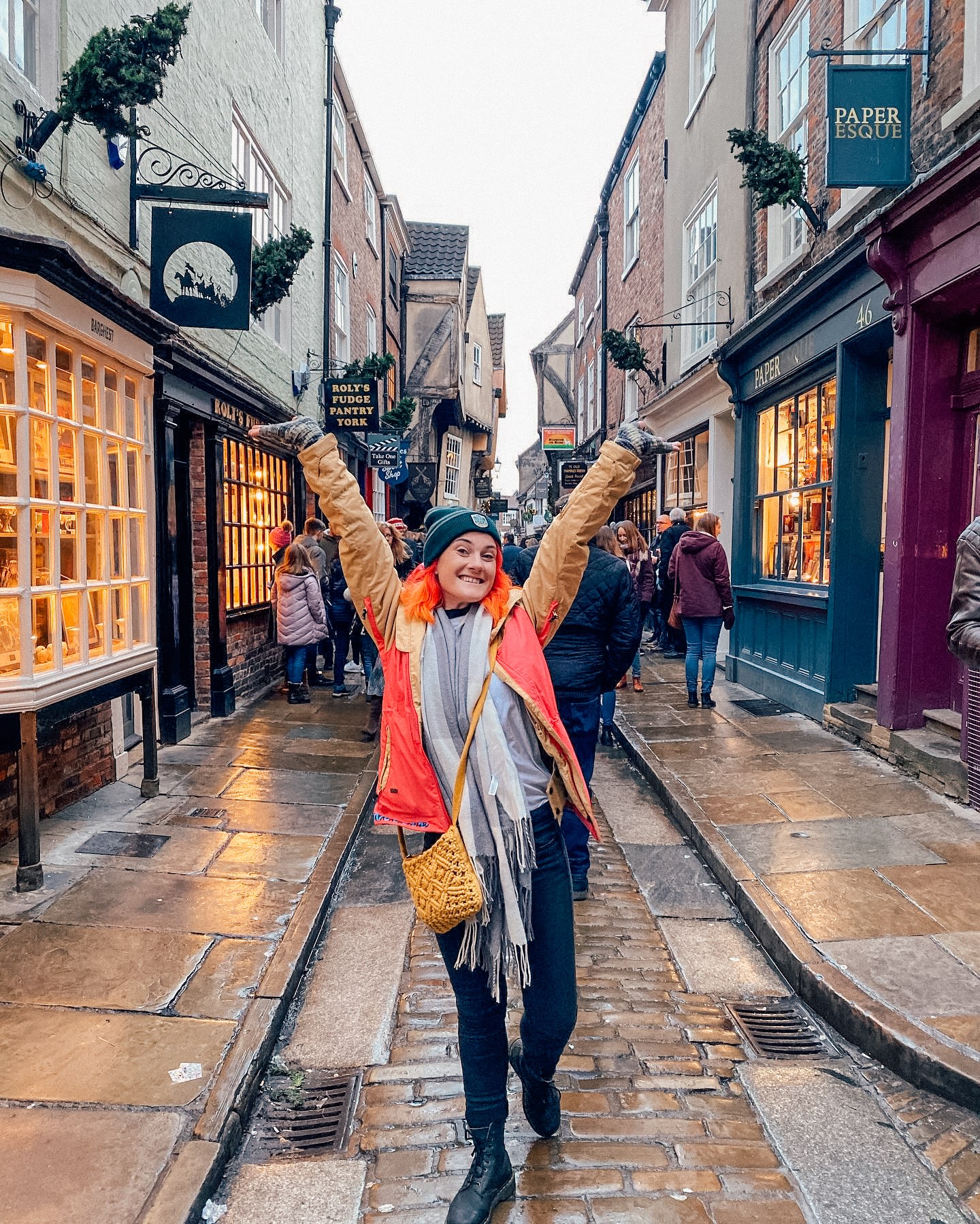 Traveller with hands up on a street in York, UK