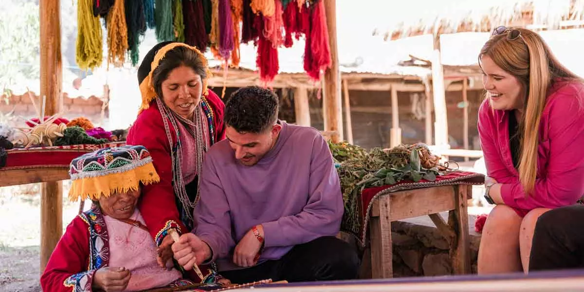 Traveler In Peru With Locals