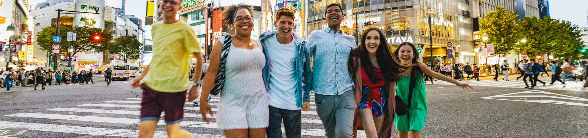 Group Of Young Travelers Exploring Tokyo Japan