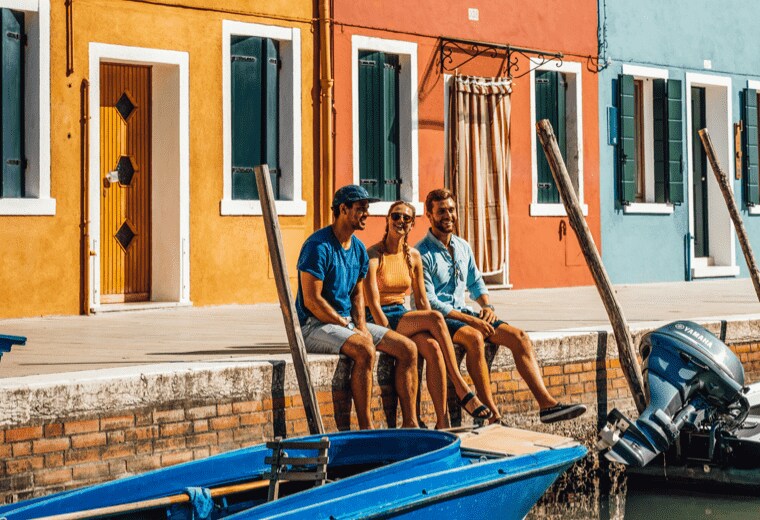 People siting on a pier in Spain