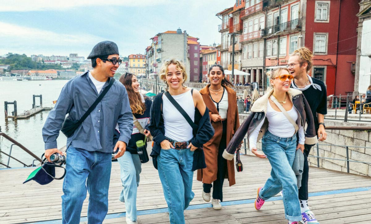 Young friends walking and smiling
