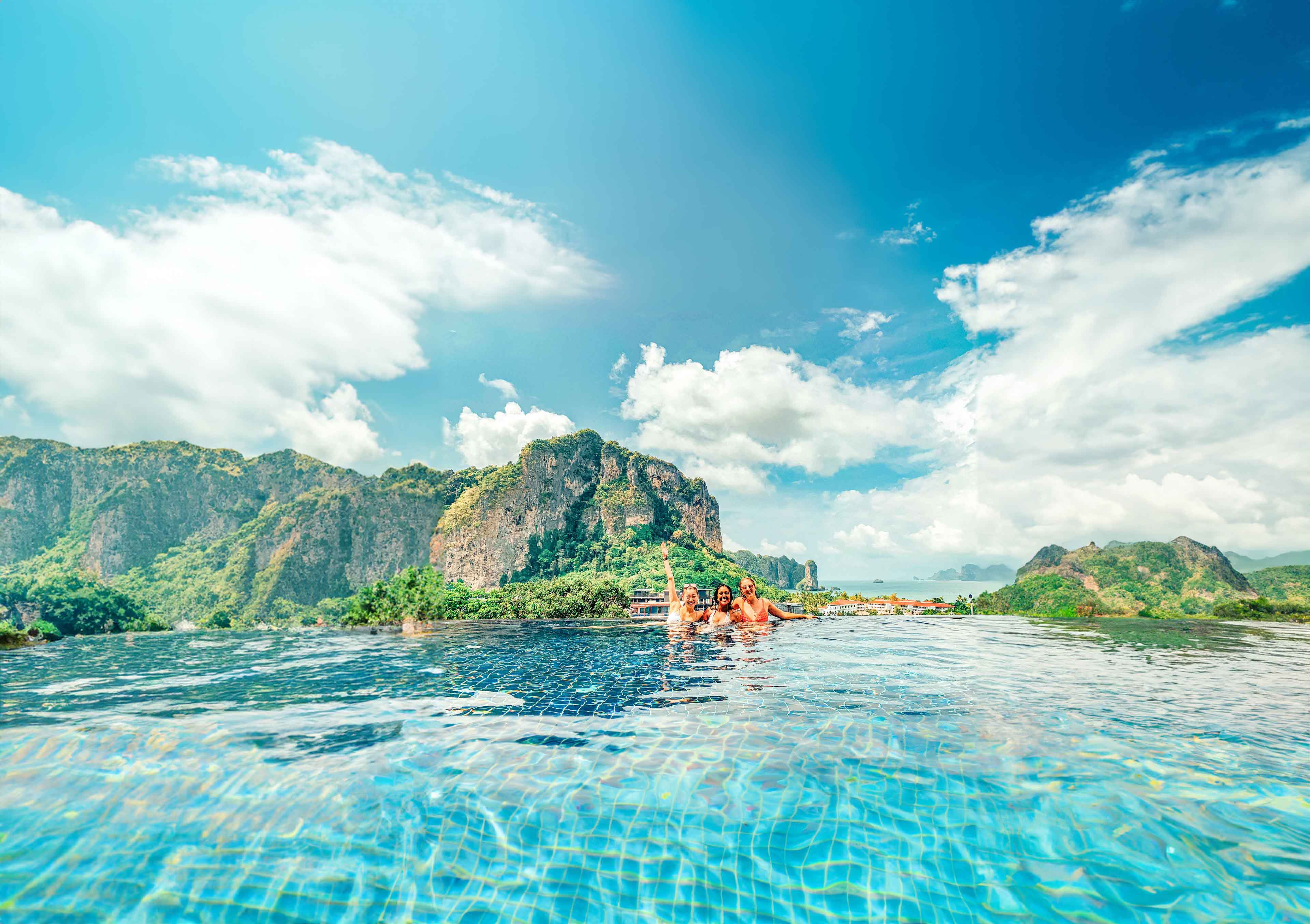 Young Group Of Travelers In Pool Thailand