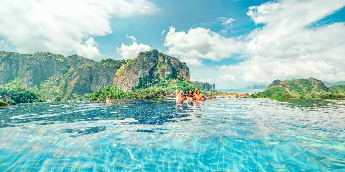 Young Group Of Travelers In Pool Thailand