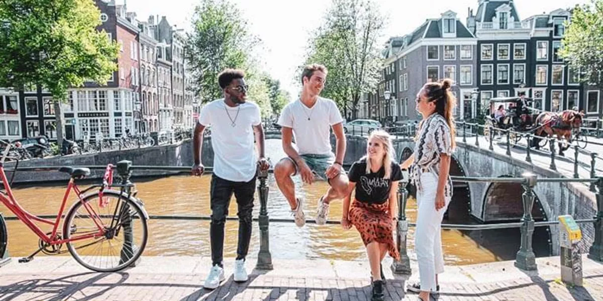 Travellers on a bridge in Amsterdam